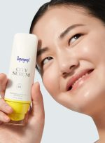 supergoop-city-serum-spf-30-model-with-pack